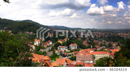 Aerial view of small town Blankenburg, Germany, at Harz mountains with roofs from above and half-timbered houses, view to Harz foreland 86384819