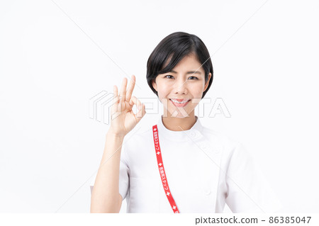 Young nurse in a casey lab coat (white background) Young nurse in a casey lab coat (white background) 86385047