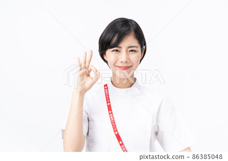 Young nurse in a casey lab coat (white background) Young nurse in a casey lab coat (white background) 86385048