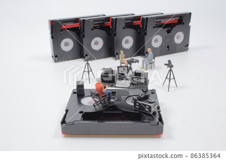 a mini figure with media studio on the DV tape 86385364