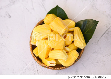 jackfruit on wooden basket with leaf, ripe jackfruit peeled tropical fruit fresh from jackfruit tree 86386570