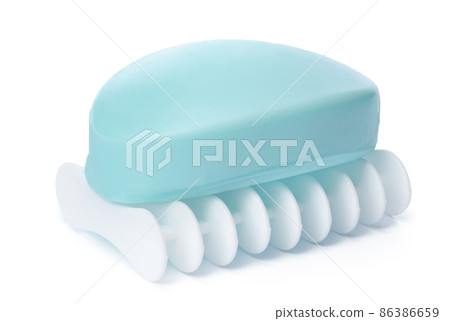 Soap on a plastic soap dish isolated on a white background Soap on a plastic soap dish isolated on a white background 86386659