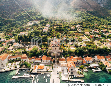 Aerial view of the Church of the Nativity of the Virgin in Prcanj by the sea Aerial view of the Church of the Nativity of the Virgin in Prcanj by the sea 86387497