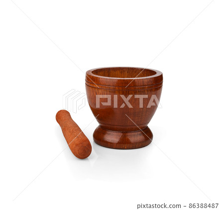 Wooden mortar and pestle on white background 86388487