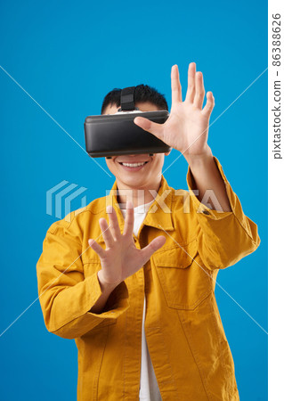 Man Playing in VR Headset 86388626