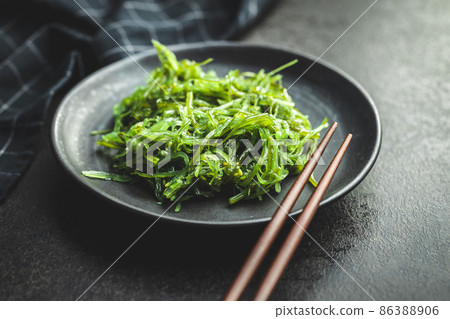 Green wakame. Seaweed salad. 86388906