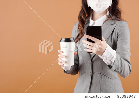 Female Entrepreneur with Coffee and Phone 86388948