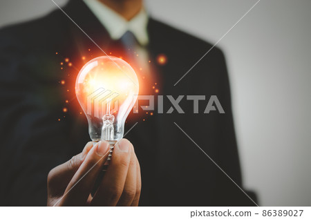 hand holding light bulb ideas Great inspiration and innovation 86389027