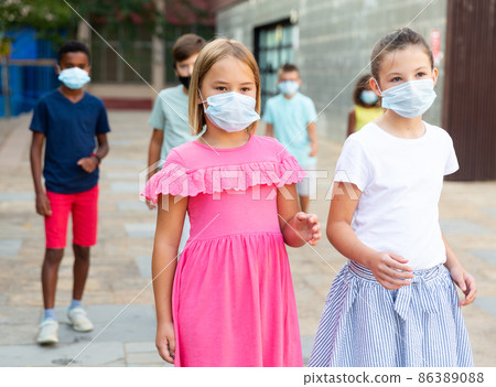 Kids walking together outdoors Kids walking together outdoors 86389088