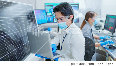 asian engineer with solar panel 86392367