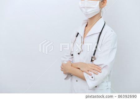 Doctor with stethoscope in medical coat on white background. Front position half body without head. Horizontal panoramic composition. Medical industry concept. Nurse in uniform healthcare concept. Doctor with stethoscope in medical coat on white background. Front position half body without head. Horizontal panoramic composition. Medical industry concept. Nurse in uniform healthcare concept. 86392690
