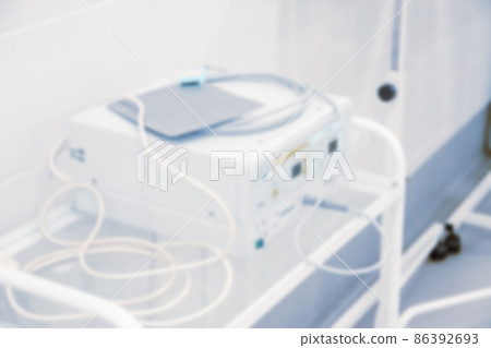 Abstract blur of hospital and clinic interior. Modern equipment in operating room. Medical devices for neurosurgery. Surgery instruments and surgical procedures. Background with blue filter. 86392693
