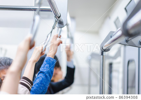 Passengers on a crowded train Passengers on a crowded train 86394308