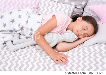 Girl happy child lay bed pillow and blanket bedroom. Girl happy child lay bed pillow and blanket bedroom. 86394428