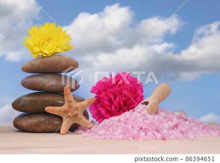 Soap and Massage Stones With Sea Shells on Blue Sky Background 86394651