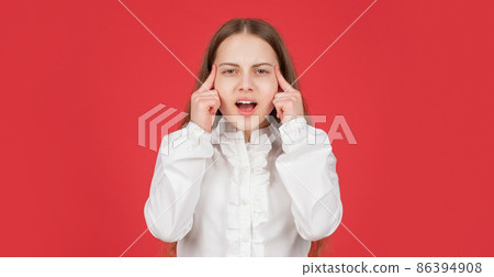 pondering kid in white shirt on red background. childhood. thinking child portrait. cognition 86394908