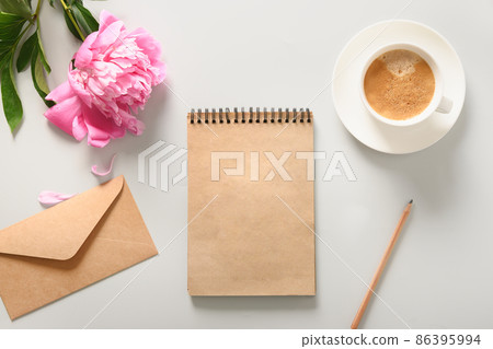 Creative female mockup with coffee cup, peony flowers, sketchbook for planning. 86395994