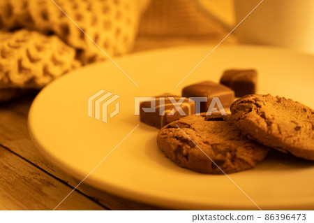 Chocolate chip cookies and chocolate on a plate 86396473