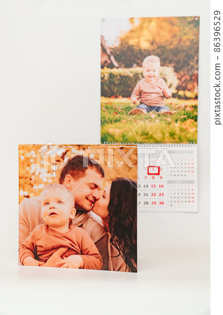 calendar for 2022 with a photo of boy and photobook from a family photo shoot.  86396529