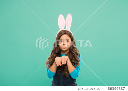 Playful mood. Preparing for Easter holiday. Small girl Playful mood. Preparing for Easter holiday. Small girl 86396887