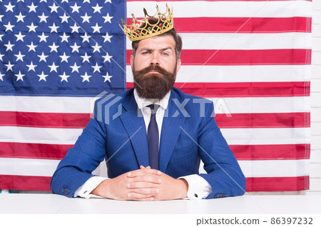 Reputable businessman handsome man sit desk american flag background, big boss concept Reputable businessman handsome man sit desk american flag background, big boss concept 86397232