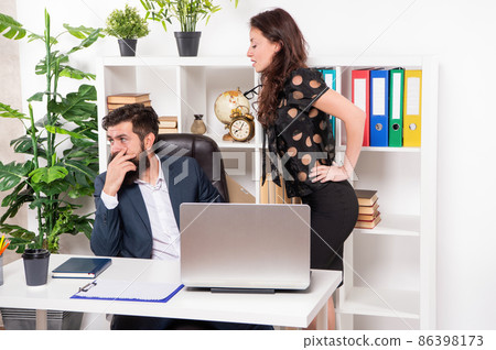 Office manager flirt with boss at workplace, flirting 86398173