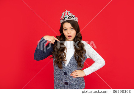 selfish child in crown. self confident queen. expressing smug. arrogant princess in tiara. 86398368