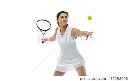 Portrait of young sportive woman, tennis player playing tennis isolated on white background. Healthy lifestyle, fitness, sport, exercise concept. 86398608