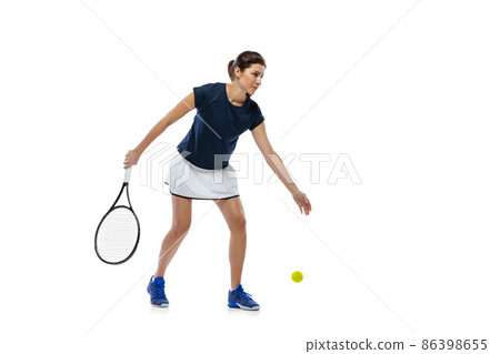 Portrait of young sportive woman, tennis player playing tennis isolated on white background. Healthy lifestyle, fitness, sport, exercise concept. Portrait of young sportive woman, tennis player playing tennis isolated on white background. Healthy lifestyle, fitness, sport, exercise concept. 86398655