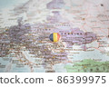 Romania flag drawing pin on the map 86399975