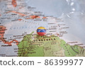 Venezuela flag drawing pin on the map 86399977