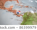 Panama flag drawing pin on the map 86399979