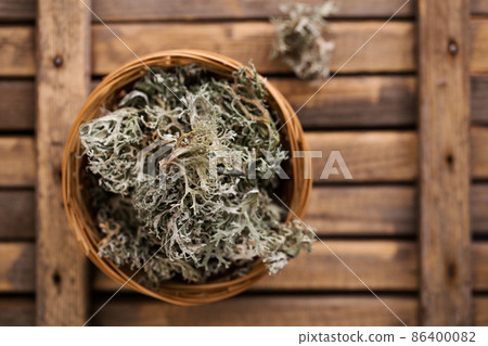 Icelandic moss in a wicker basket, top view 86400082