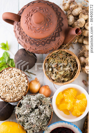 Still life for tea drinking with herbs, top view 86400172