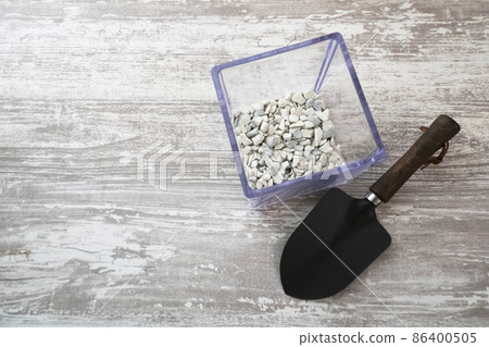 Gardening image of root rot inhibitor and shovel Gardening image of root rot inhibitor and shovel 86400505