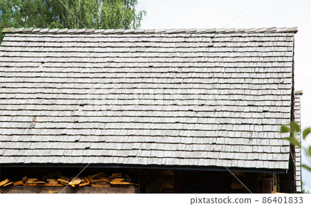 shingle roof. Old method of making roofs from wood, background. Copy space for text 86401833