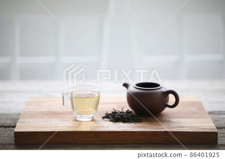 Glass tea cup and clay tea pot Glass tea cup and clay tea pot 86401925
