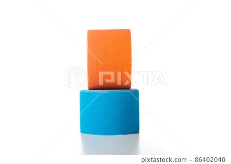Blue and orange medical kinesiology tape on a white background. Isolate, teping, close-up 86402040