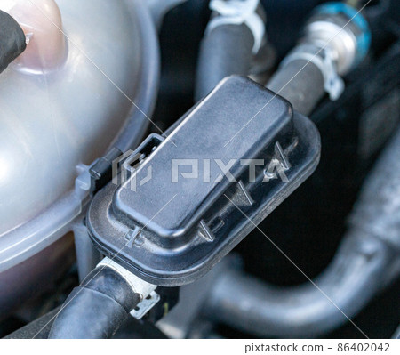 Fuel valve in the fuel line of a diesel engine, close-up, Electronics Fuel valve in the fuel line of a diesel engine, close-up, Electronics 86402042