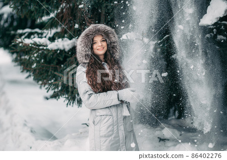 happy young woman in red hat in winter. toned photo 86402276