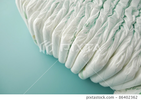 stack of baby diaper on light green background  86402362
