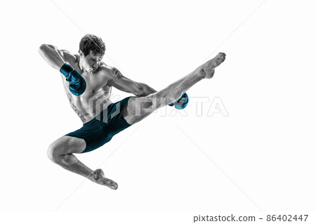 Full size of athlete boxer who perform muay thai martial arts in studio silhouette. BLUE sportswear Full size of athlete boxer who perform muay thai martial arts in studio silhouette. BLUE sportswear 86402447