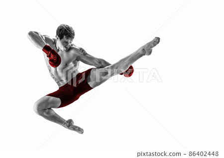 Full size of athlete boxer who perform muay thai martial arts in studio silhouette. Red sportswear  86402448