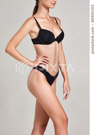 gorgeous slim woman with perfect body in black underwear 86404165