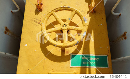 yellow emergency door at a ship yellow emergency door at a ship 86404441