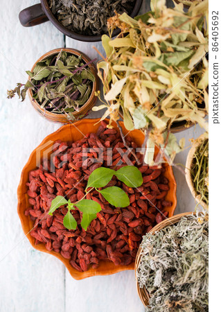 goji berries and dry herbs collection. Top view 86405692