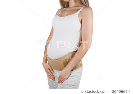 Pregnant woman belly in prenatal pregnancy maternity belt isolated on white background. Support waist, back, abdomen band. Belly Brace. Belly band for pregnancy. Orthopedic abdominal support belt. 86406654