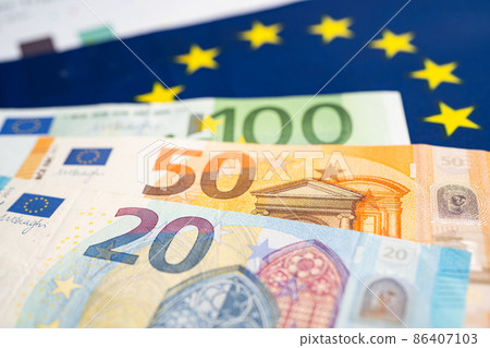 EU banknotes money on flag in europe , Business and finance concept. EU banknotes money on flag in europe , Business and finance concept. 86407103