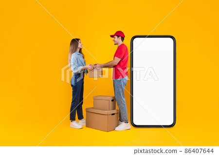 Courier Near Smartphone Screen Giving Parcel To Female, Yellow Background 86407644