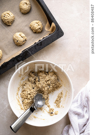 Gluten free raw, uncooked banana cookies with chocolate chips. Healthy homemade biscuits, top view. 86408487